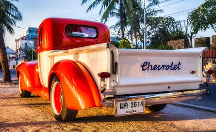 Red and white truck parked