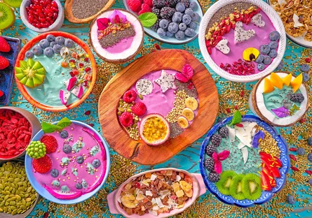 Colorful fruit and vegetable salad with dip on table