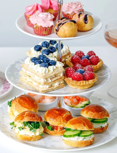 Three tiered plates with desserts