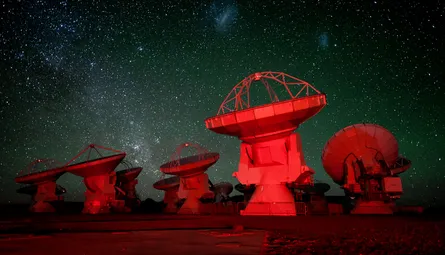 Space telescope in background red domed structures foreground