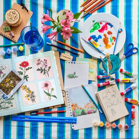 Handmade art crafts supplies on table