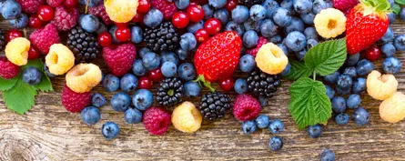 Fresh berries on wood surface