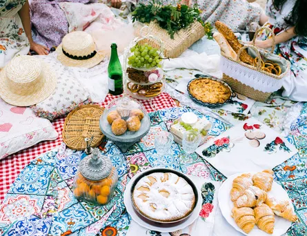 People sitting on picnic blanket
