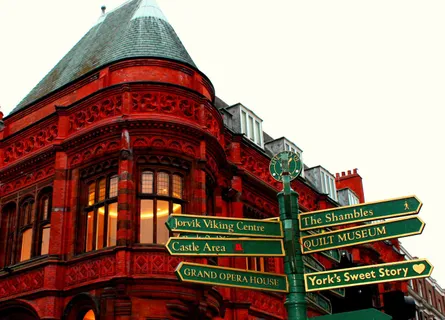 Tall red building with signs