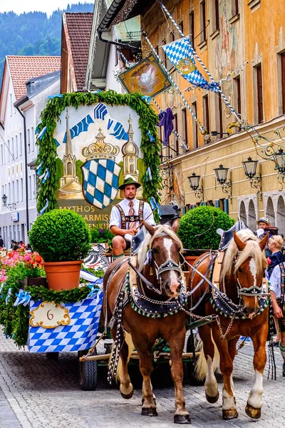 Horse and carriage in street