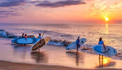 Surfers in Sunset