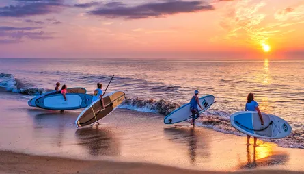Surfers in Sunset