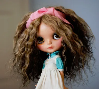 Curly haired doll with brown hair