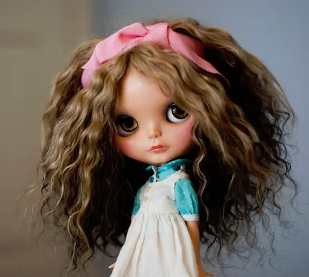 Curly haired doll with brown hair
