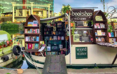 "Colorful Bookboat on River"