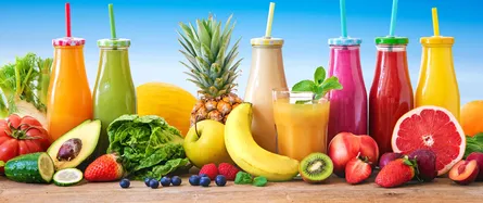 Fresh fruit and juice on table