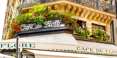 Floral balcony, cafe on left