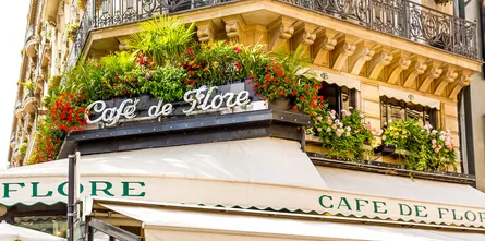 Floral balcony, cafe on left