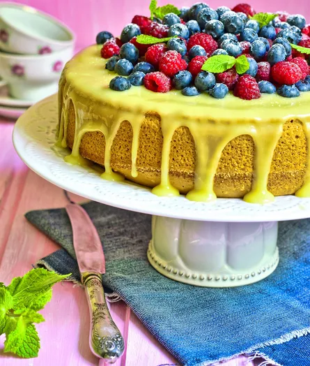Cake with frosting and blueberries
