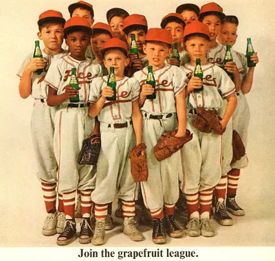 Baseball team posing with soda bottles