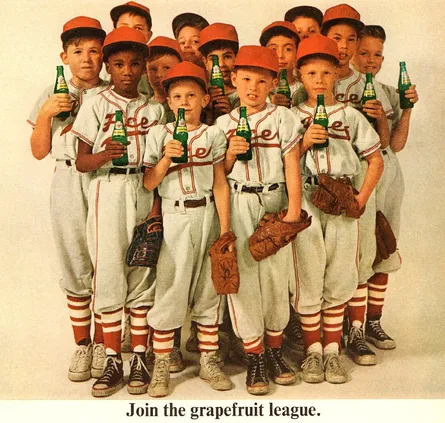 Baseball team posing with soda bottles