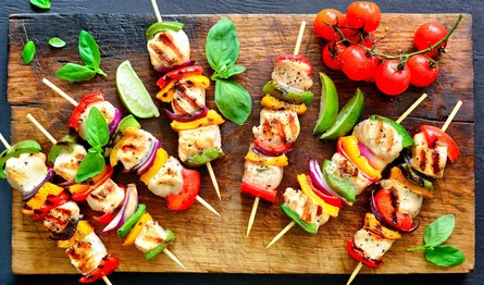 Kebabs on wooden cutting board