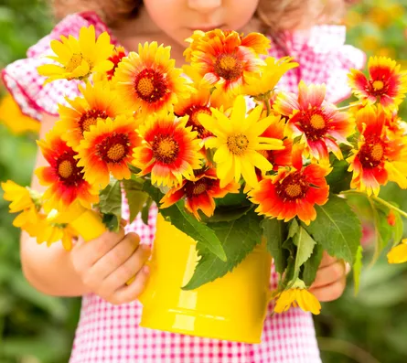 Little girl holding flowers