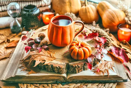 Pumpkin, mug of coffee, autumn leaves