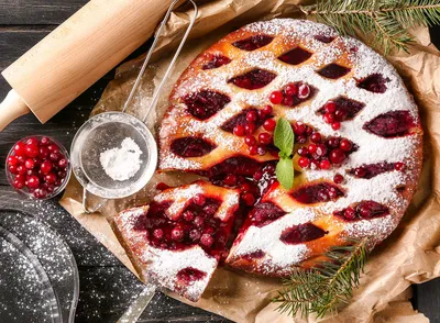 Delicious dessert, red berries, sugar powder on cake
