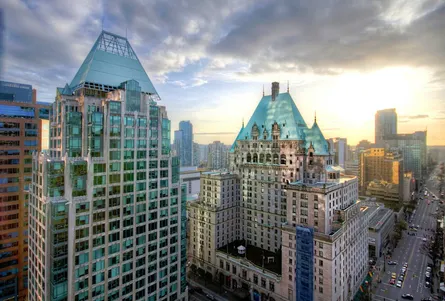 City skyline from above, modern building in foreground, skyscraper, tall building, urban architecture, high rise