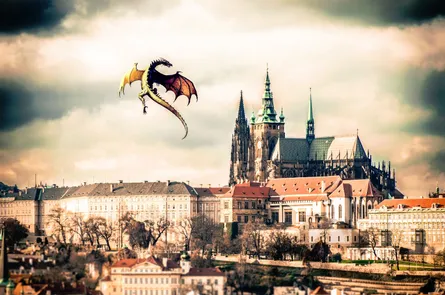 The dragon is flying near the castle