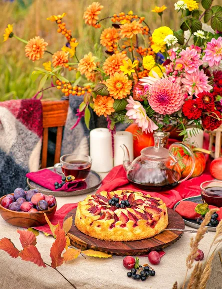 Delicious cake surrounded by fall decorations