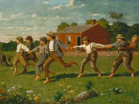 Group of people running together in the grass