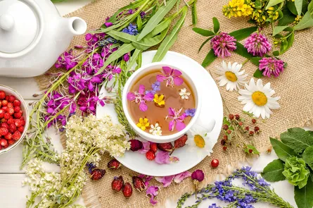 A table of wildflowers with tea cup in center