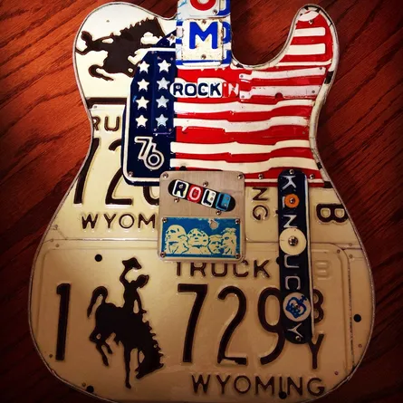 Painted guitar shaped sign