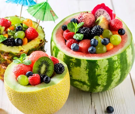 Colorful fruit bowl on table