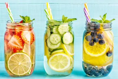 Three pitchers of fruit juice