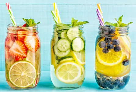 Three pitchers of fruit juice