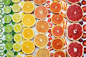 Colorful citrus fruits arranged in rows