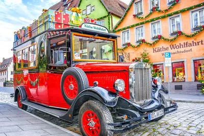 Red Carriage in Village