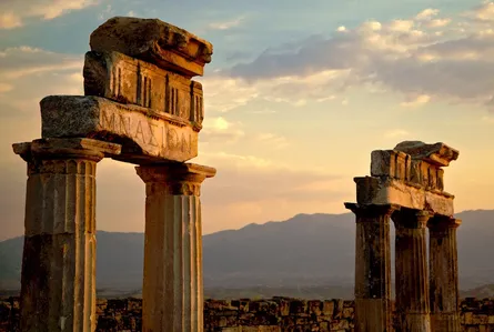 Stone pillars sunset clouds mountain landscape