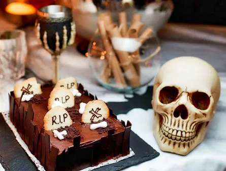 Cake with tombstones and cookies
