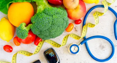 Healthy food and measuring tape