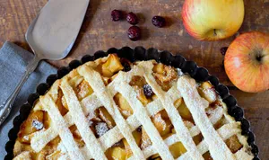 Fruit pie with crust on board