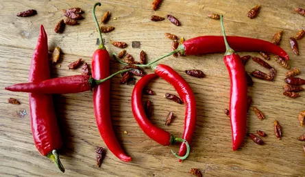 Hot spicy peppers on table