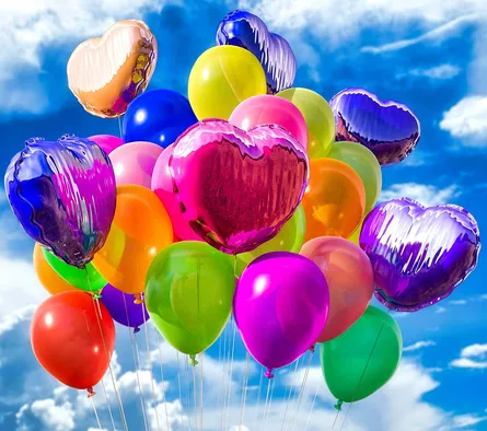 Many colorful balloons floating together