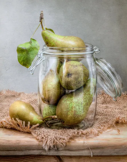 Green pears in glass jar