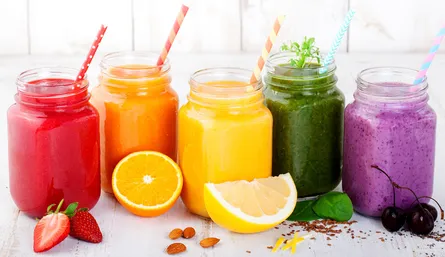 Colorful smoothies on shelf
