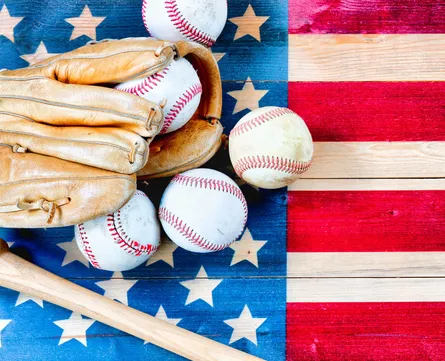 Baseball equipment and american flag background