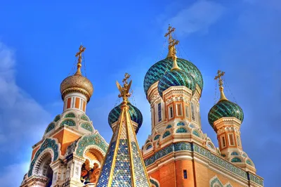 Colorful church with domes and crosses on top