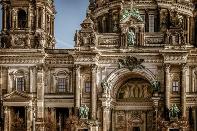 Ornate building with arches and statues