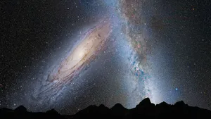 A wallpaper of the galaxy with constellations and nebulae, featuring the Milky Way and several stars