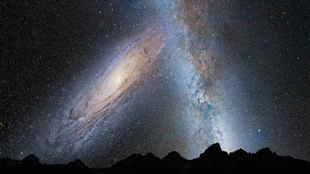 A wallpaper of the galaxy with constellations and nebulae, featuring the Milky Way and several stars