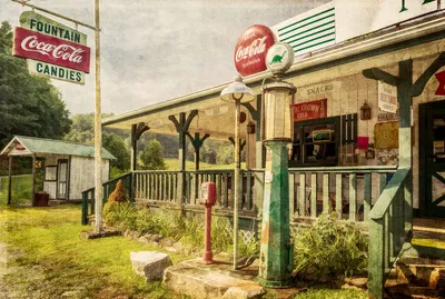 Coca cola sign outside old gas station