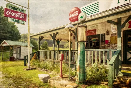 Coca cola sign outside old gas station